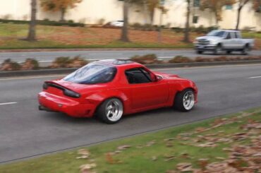 [Mazda Miata] with what I assume is a custom made kit that resembles an RX-7