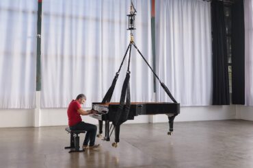 Tesla Bot's Leg Actuator Lifting a Half-Ton Piano