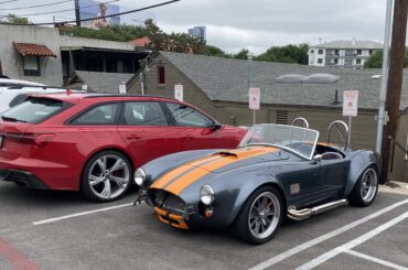 Uniquely colored [Shelby Cobra] replica? looking tiny next to an Audi