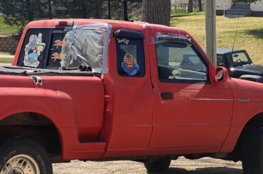 Who drives this abused, tropical themed Ranger? Note the hole punched in the bodywork...