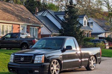 Finally got a good photo of my neighbours [Cadillac Escalade/Chevy 1500].