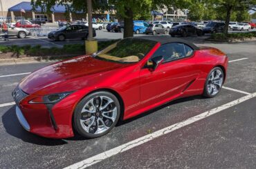 A red [Lexus LC500] in the Lowe's parking lot