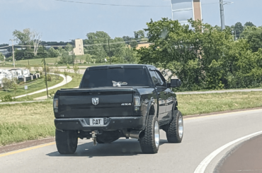 Who are these people that don't need a license plate? Or does he think he's a cat? (in Kansas)