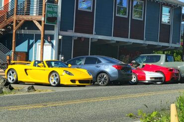 Spot of a lifetime in my tiny town. [Porsche Carrera GT, Ferrari Testarossa, Ferrari 458 Spyder]