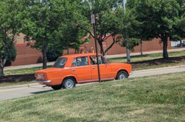 Orange Lada in America, the official car of. . .