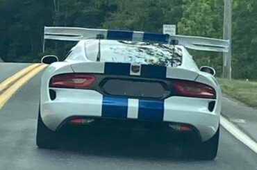 Here's a [5th gen Dodge Viper ACR] with blue stripes.