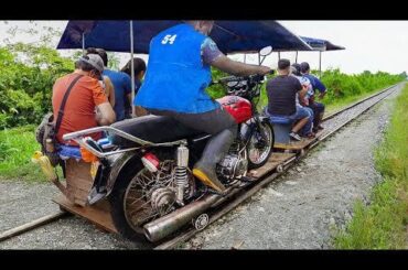 Motorbikes converted into cheap trains in Colombia.