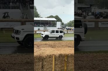 New electric Mercedes EQG taking turn one at the Goodwood hill climb in the rain