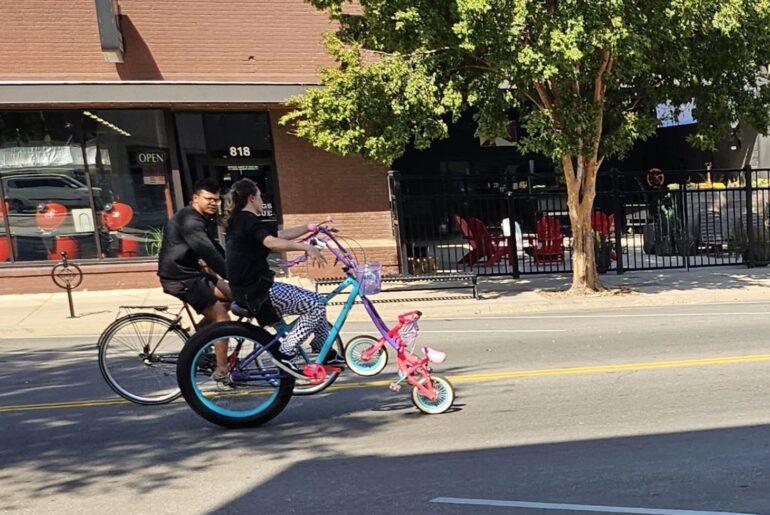 A bike where the front wheel is a smaller bike